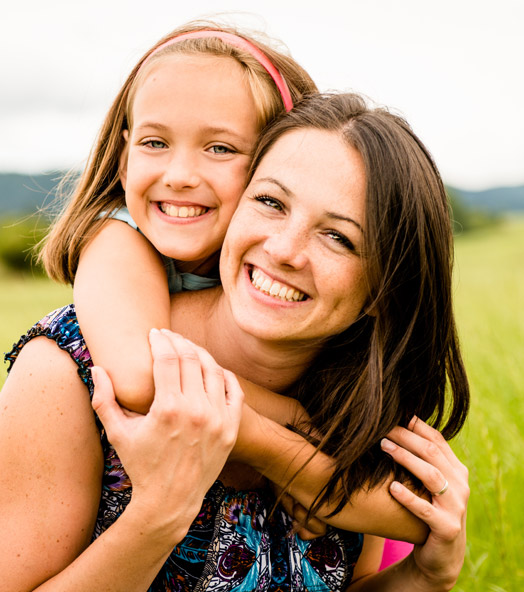 Mommy Makeover - smiling female with daughter