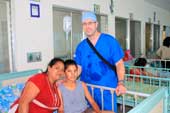 Surgical Mission: little girl after operation with Dr. Morin in viewing room