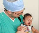 Surgical Mission: Dr. Morin and child