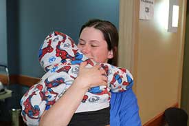 Surgical Mission: little child on hands